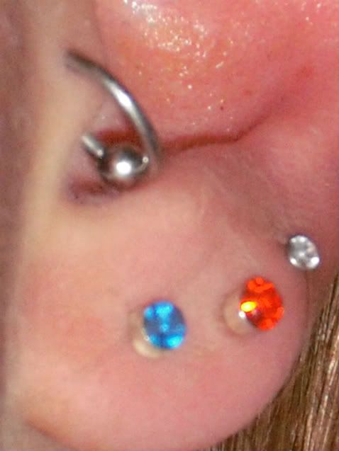  tragus piercing. How does it look. ITs a bit irritated.