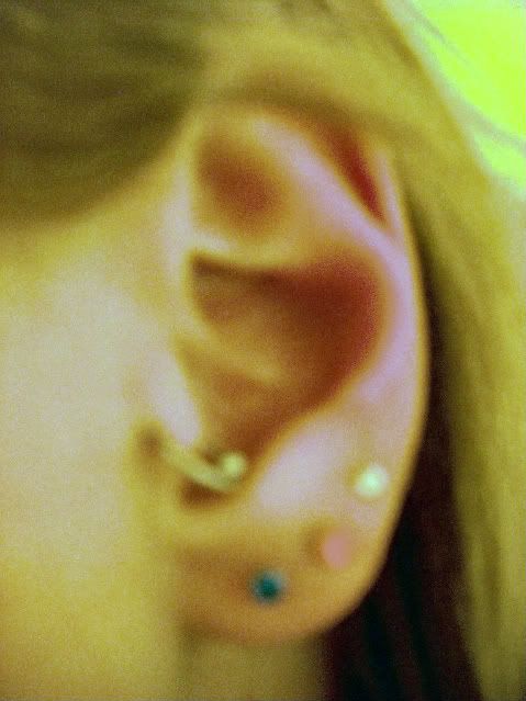 Here are some pictures of my one week old tragus piercing. How does it look.